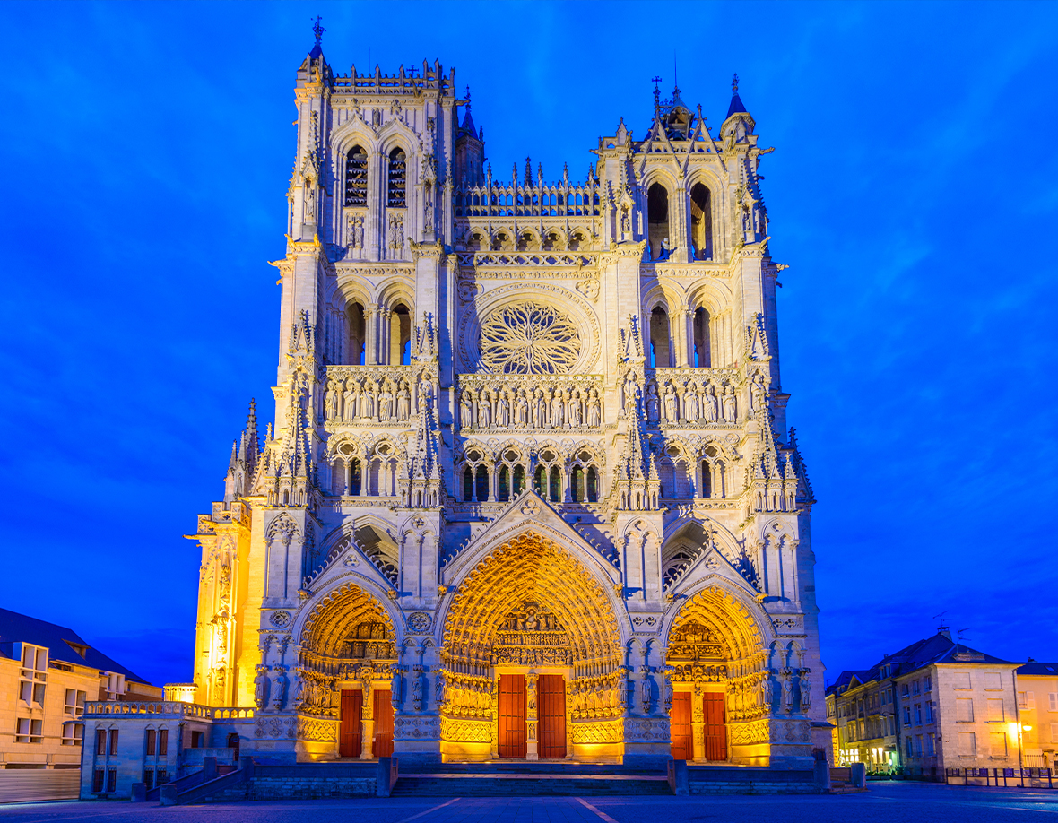 Amiens large gothic cathedral at night lit up with lights